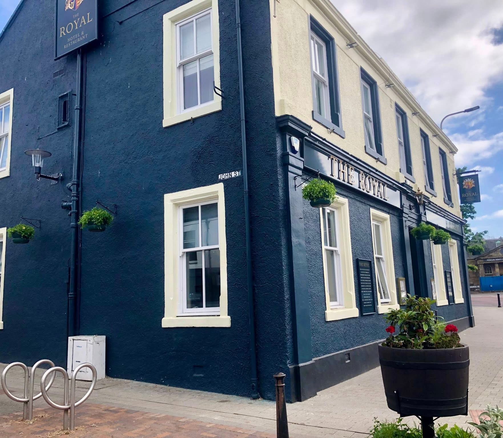 Side view of The Royal Hotel Bar and Restaurant building in Penicuik during the day