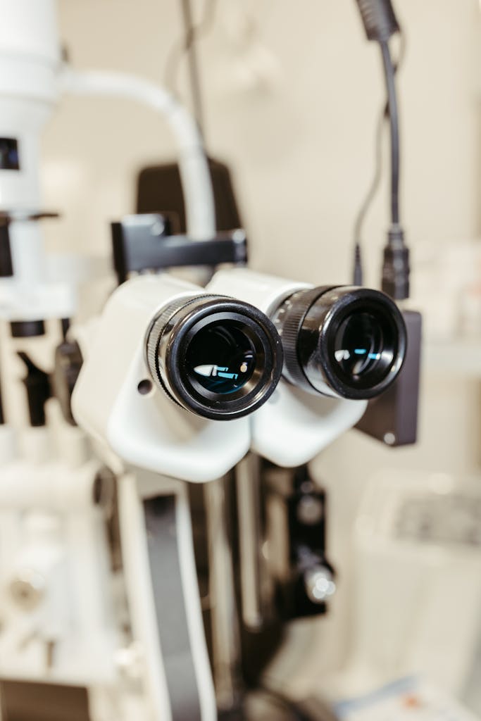 Close-up of binocular eye examination device used in optometry and ophthalmology clinics.